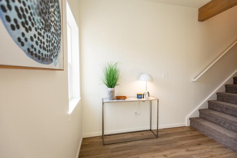 Entry way with table and stairs