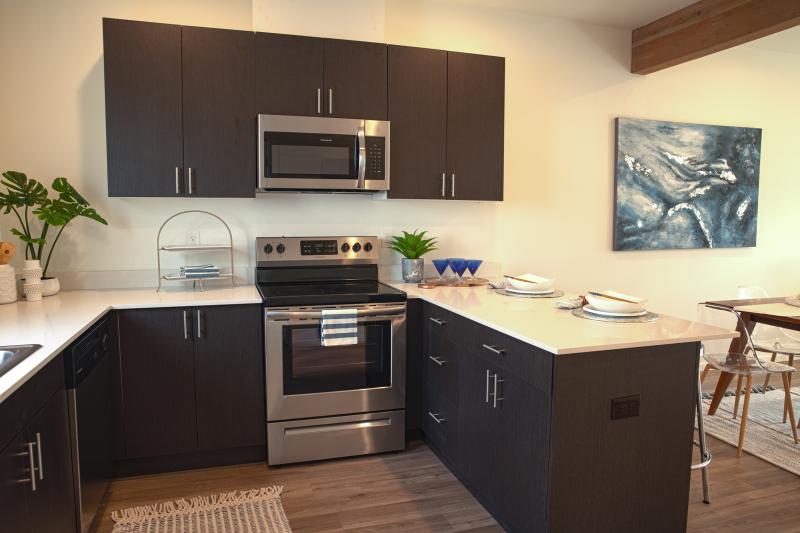 Kitchen with island bar and modern appliances