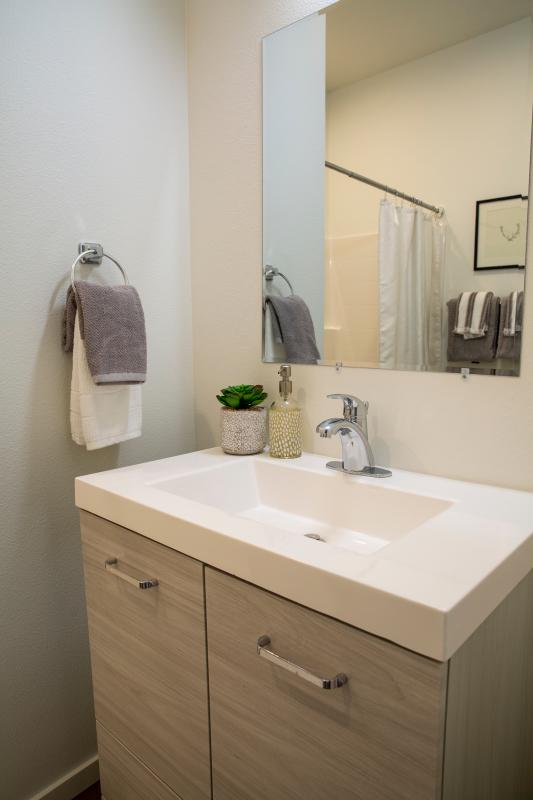 Bathroom vanity, sink, and mirror